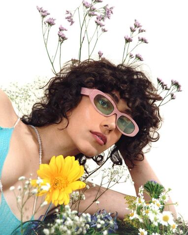 Shot of a female model wearing pink glasses from Bonnie Clyde Spring Summer Collection 2021 
